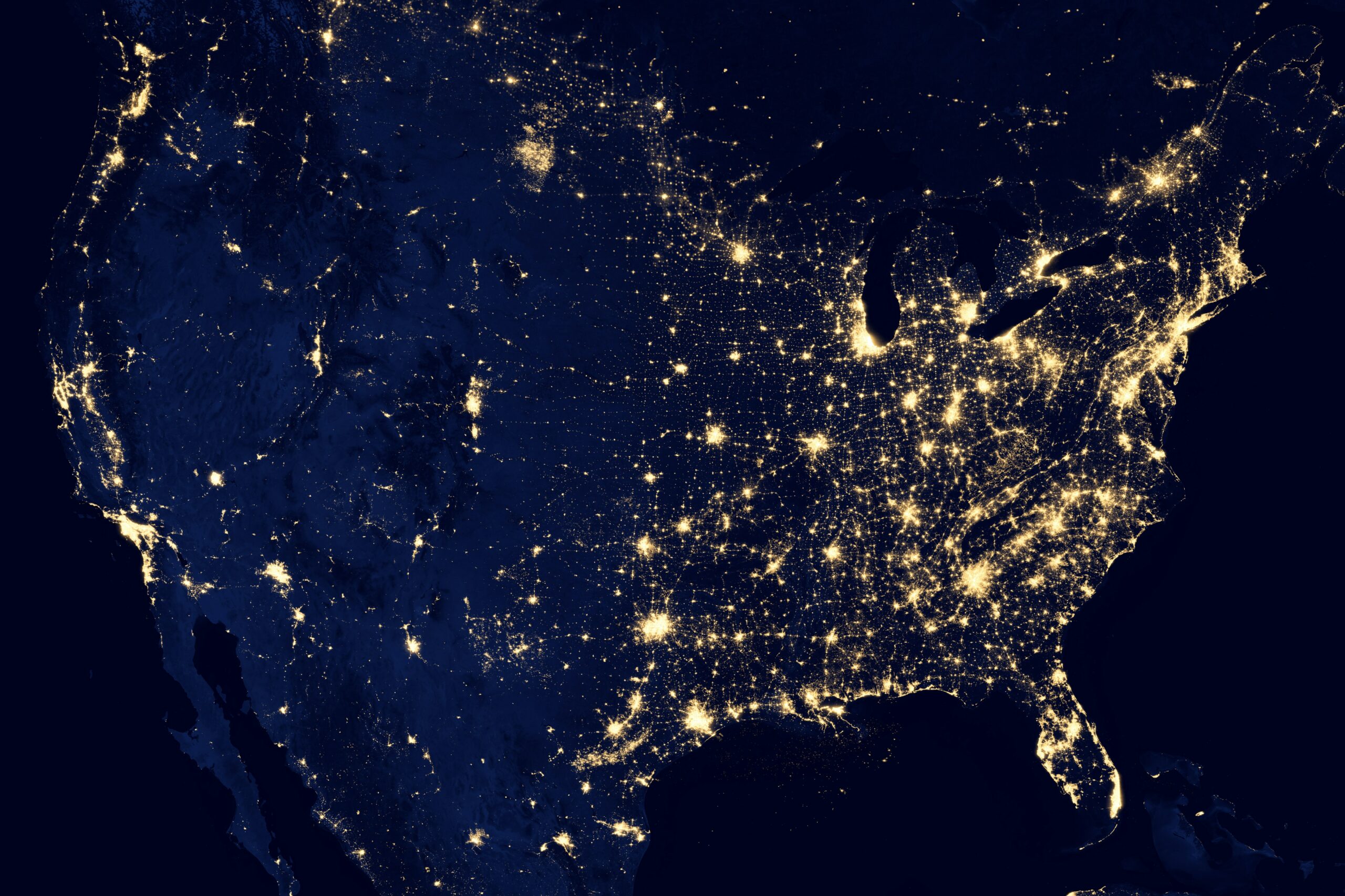 Shot of earth from space, at night, as city lights twinkle