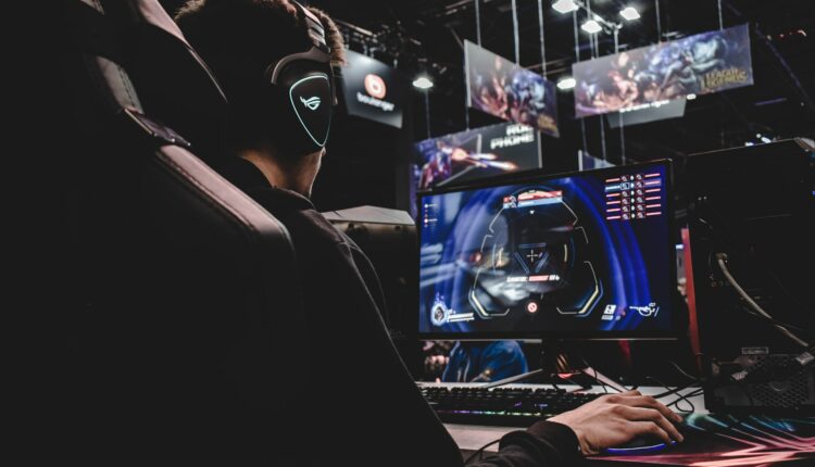 professional gamer at computer in arena for Real LUCK